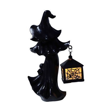 Illuminate Your Halloween Nights with a Witch Figurine and Lantern Combo from Cracker Barrel